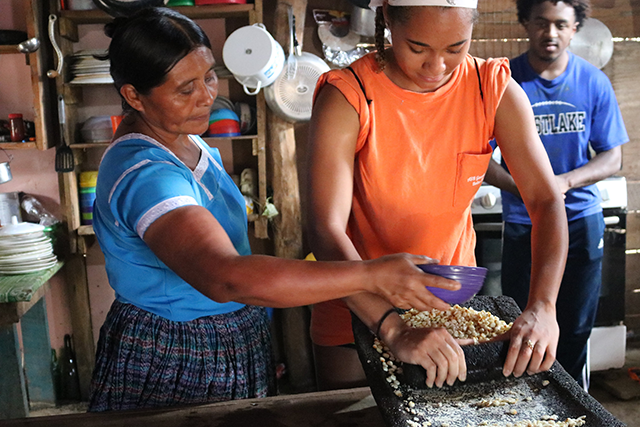 A local woman teaches a GT student how to make corn tortillas during an Alternative Service Trip abroad.
